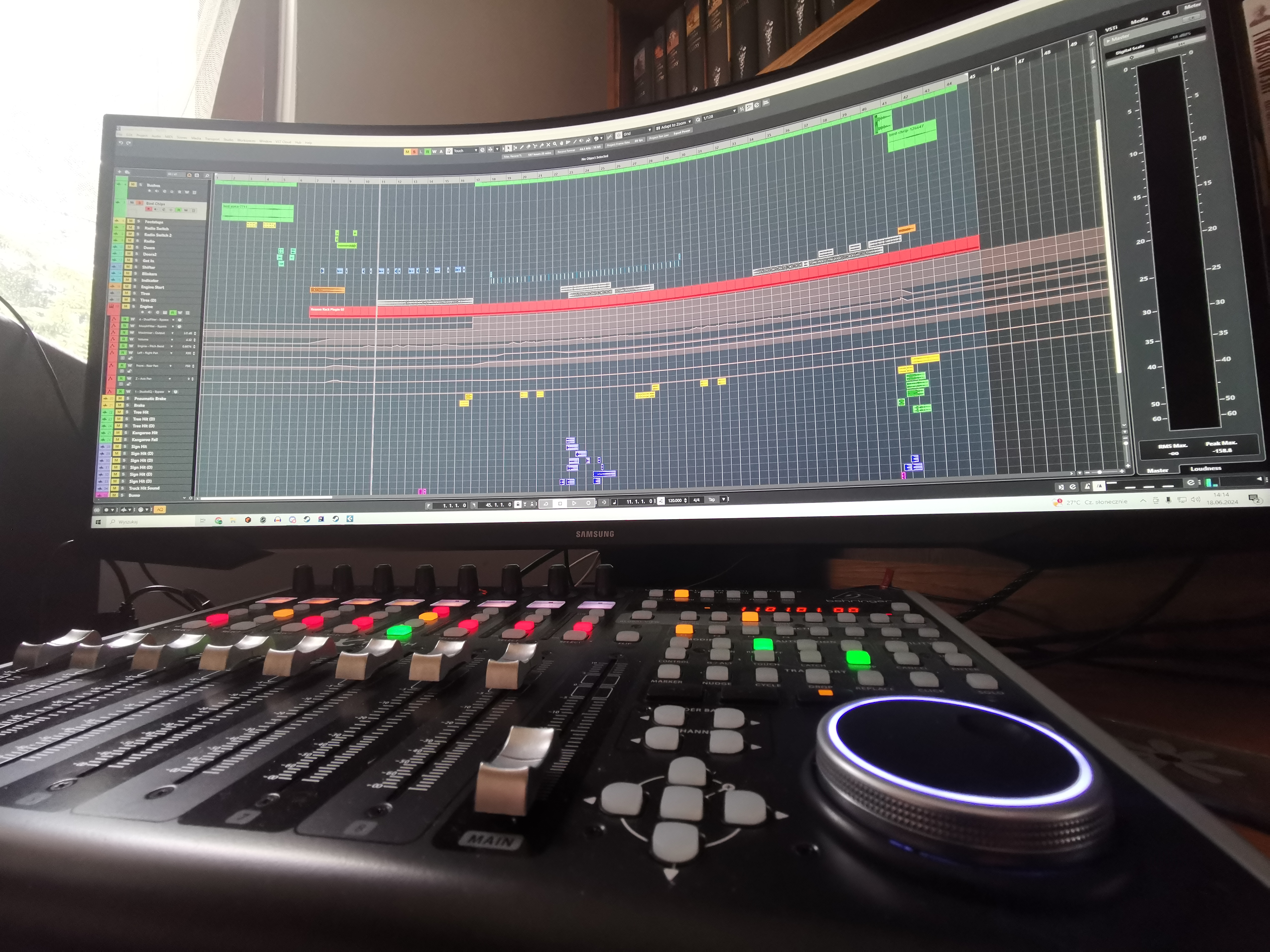 photo of a mixer with a computer monitor in background